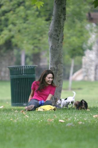 Emmy playing with her dogs in the park
