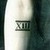  the roman numbers XIII on his right arm