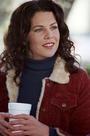  What item does Lorelai bring into the diner the dag of her and Luke's reconciliation?