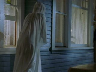  When Willow appears in her ghost costume in episode "Halloween", what does it say on the front?