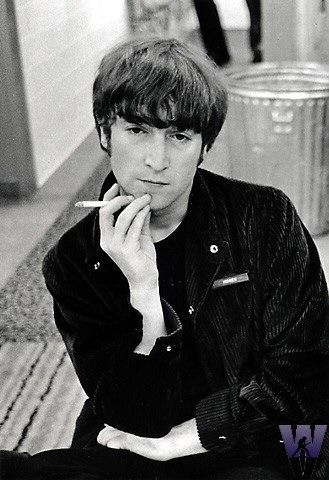 Who taught John Lennon proper guitar chords?