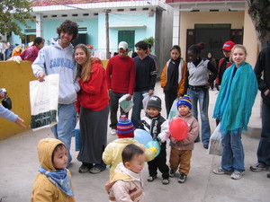  Cinders (in the red sweatshirt) volunteering at a preschool in Vietnam with classmates
